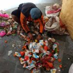 Kailapira Worker Cleaning Flowers Temple